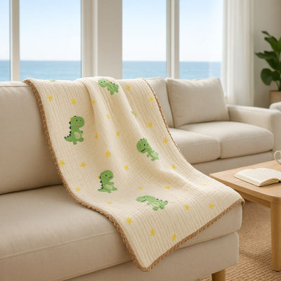 Couverture bebe nomade design dinosaure vert posee canapé lavable douce