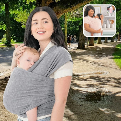 Jeune-maman-sur-un-chemin-arboré-portant-son-bébé-dans-son-écharpe-de-portage-gris-clair-élégante-et-soignée.