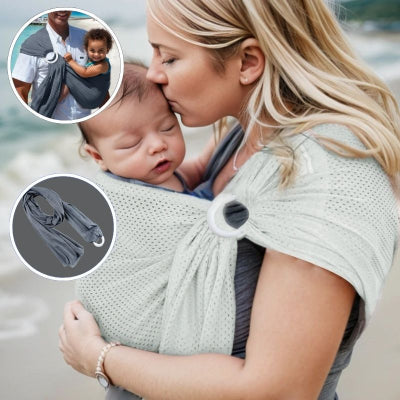 Jeune-maman-à-la-plage-portant-avec-plaisir-son-bébé-dans-son-écharpe-de-portage-gris-clair-confortable-design-et-respirante