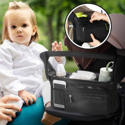 Maman-et-sa-fille-a-côté-du-sac-à-langer-pratique-et-fonctionnel-léger-fixé-à-la-poussette-dans-lequel-se-trouve-2-biberons-un-téléphone-des-couches-et-la-pochette-détachable-spéciale-lingettes