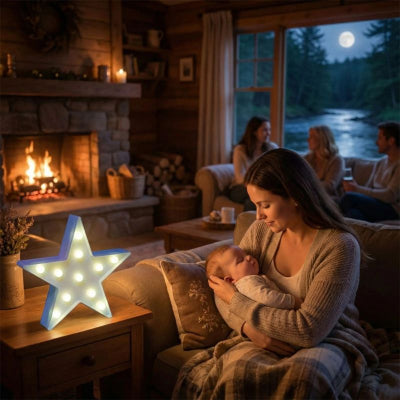 Bébé dort bras maman etoile lumineuse bebe design bleu 5 branches energie piles salon chalet amis 