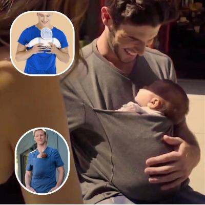 bébé-est-dans-son-porte-bébé-physiologique-vert-à-col-en-V-et-dort-paisiblement-dans-les-bras-de-son-papa-à-côté-de-sa-maman-sur-une-terrasse