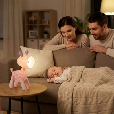 Bébé dort salon veilleuse bebe cerf design rose a pois ludique parents
